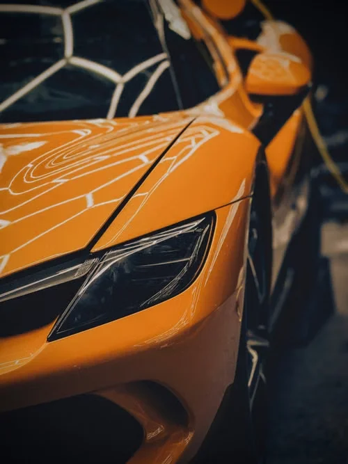 Orange sports car after exterior detailing